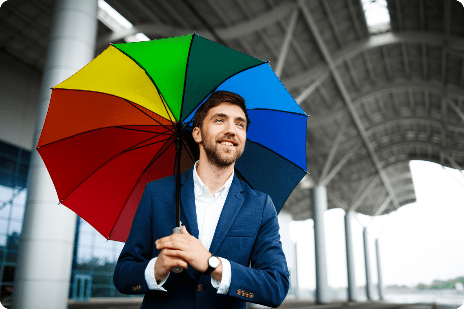 man with colourful umbrella